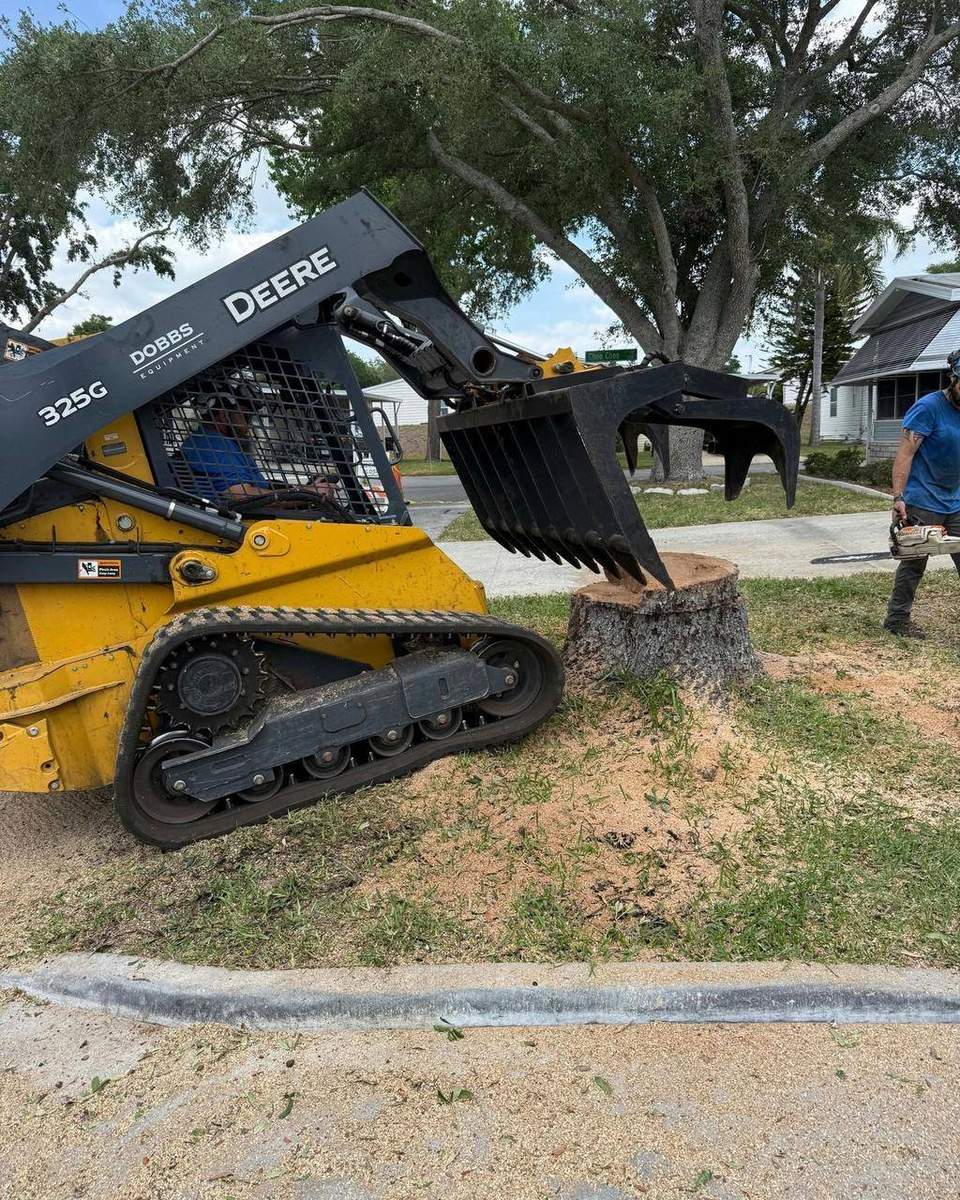 Compact loader used for land clearing and debris work